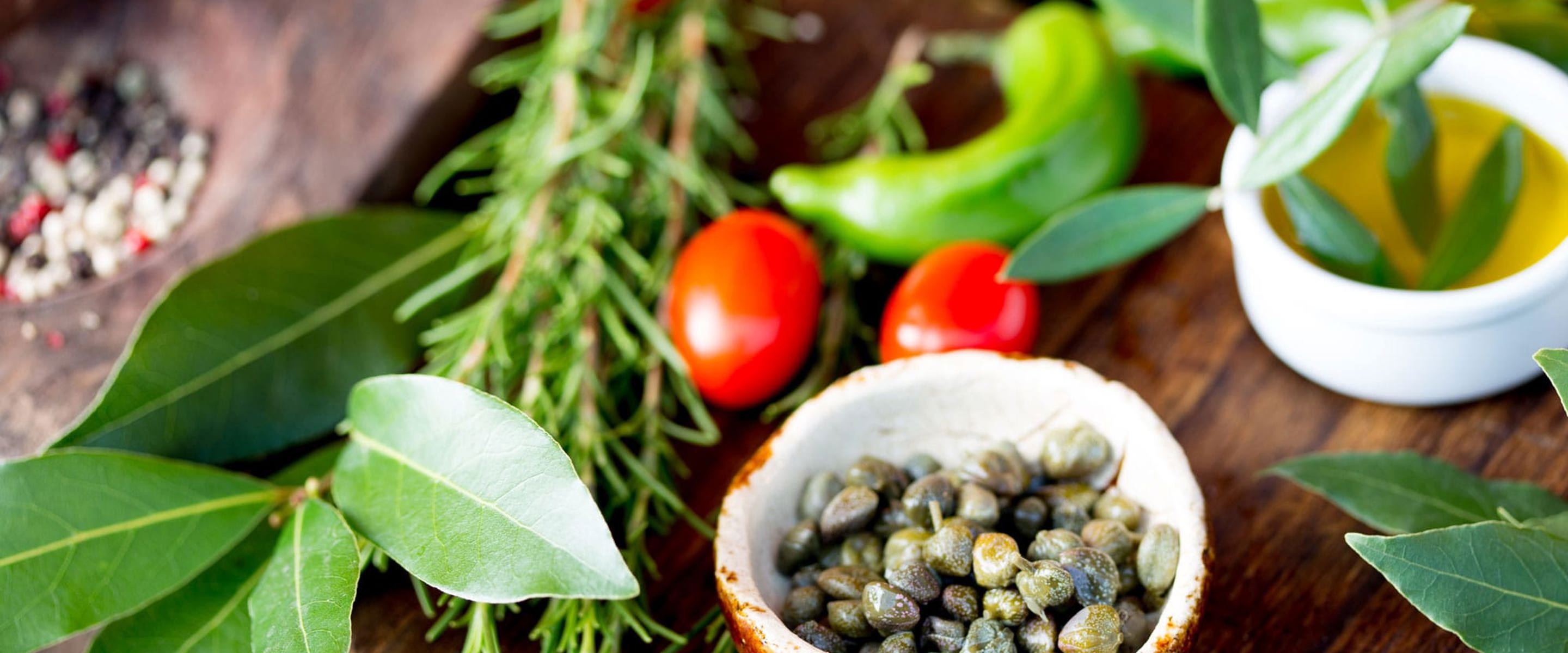 An array of freshly picked herbs and vegetables