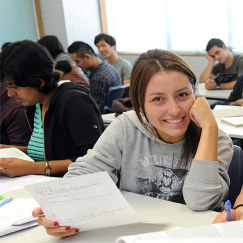 Image of students writing in class