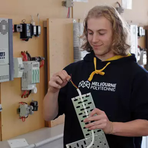 Electrical student working on conduit