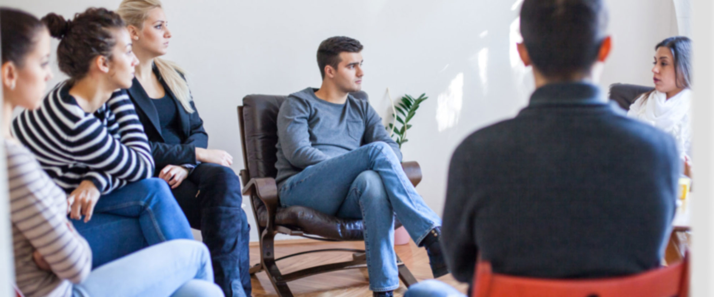 NDIS study area image - A group of people sitting in a circle and listening to one another talk