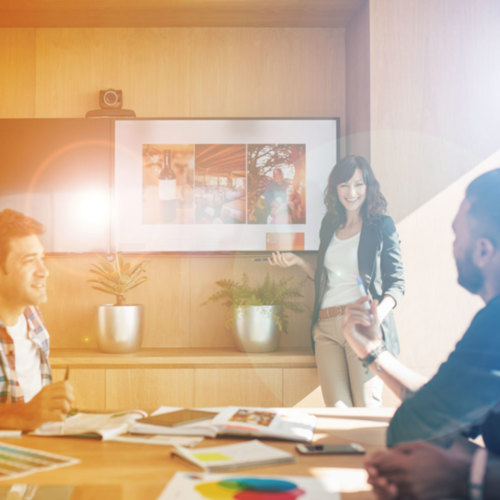 A group of people having a team discussion in an office