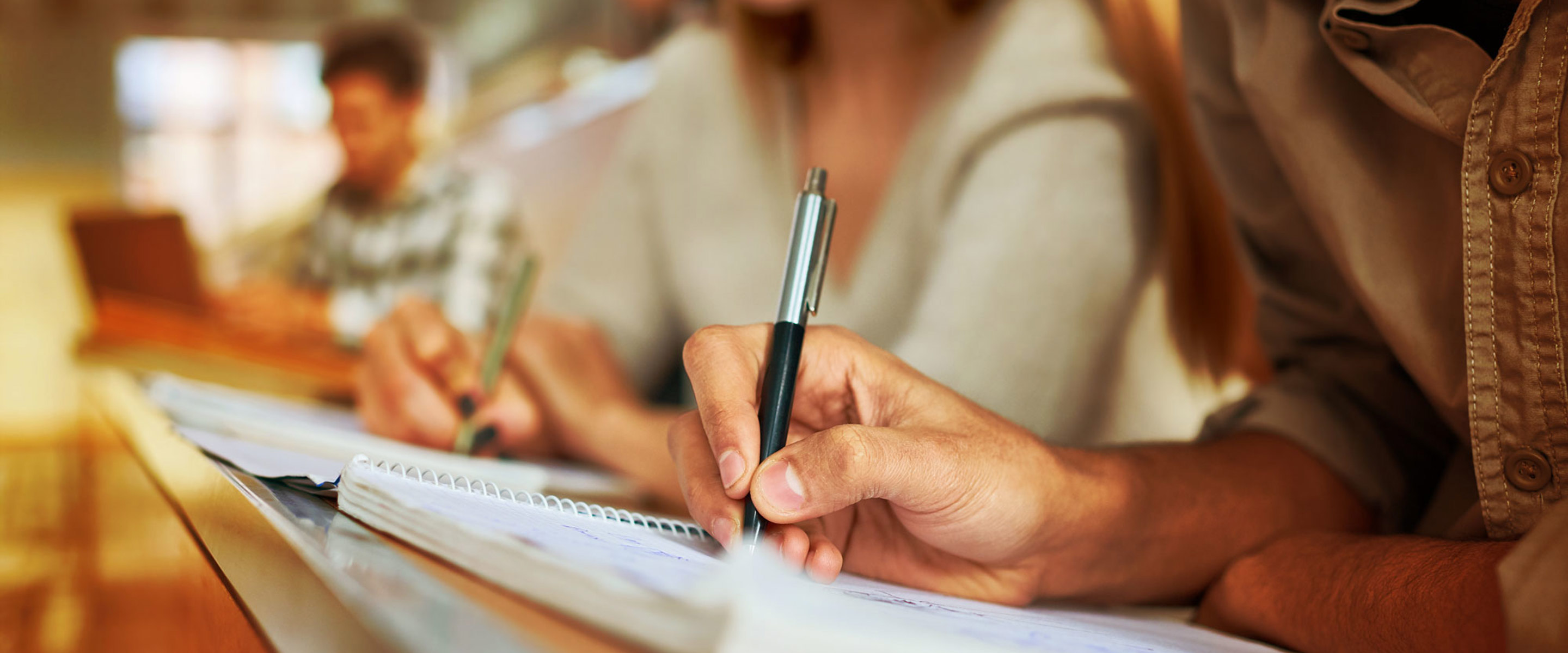 Students copying notes in a classroom