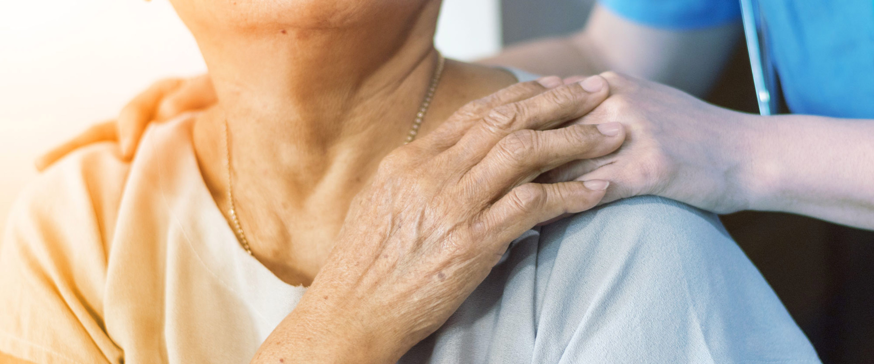 A support worker taking care of an elderly woman