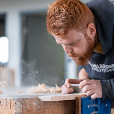 Image of student carl practising wood work