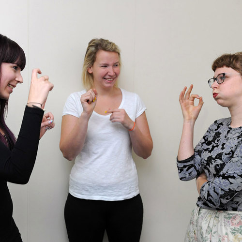 three women signing using Auslan