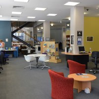 Work stations and meeting tables inside Melbourne Polytechnic's Prahan library